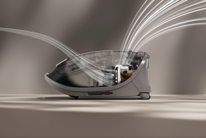 Le purificateur d'air Miele GUARD M1 FLEX fonctionne avec une efficacité élégante, avec un design futuriste et des lignes de flux d'air visibles.