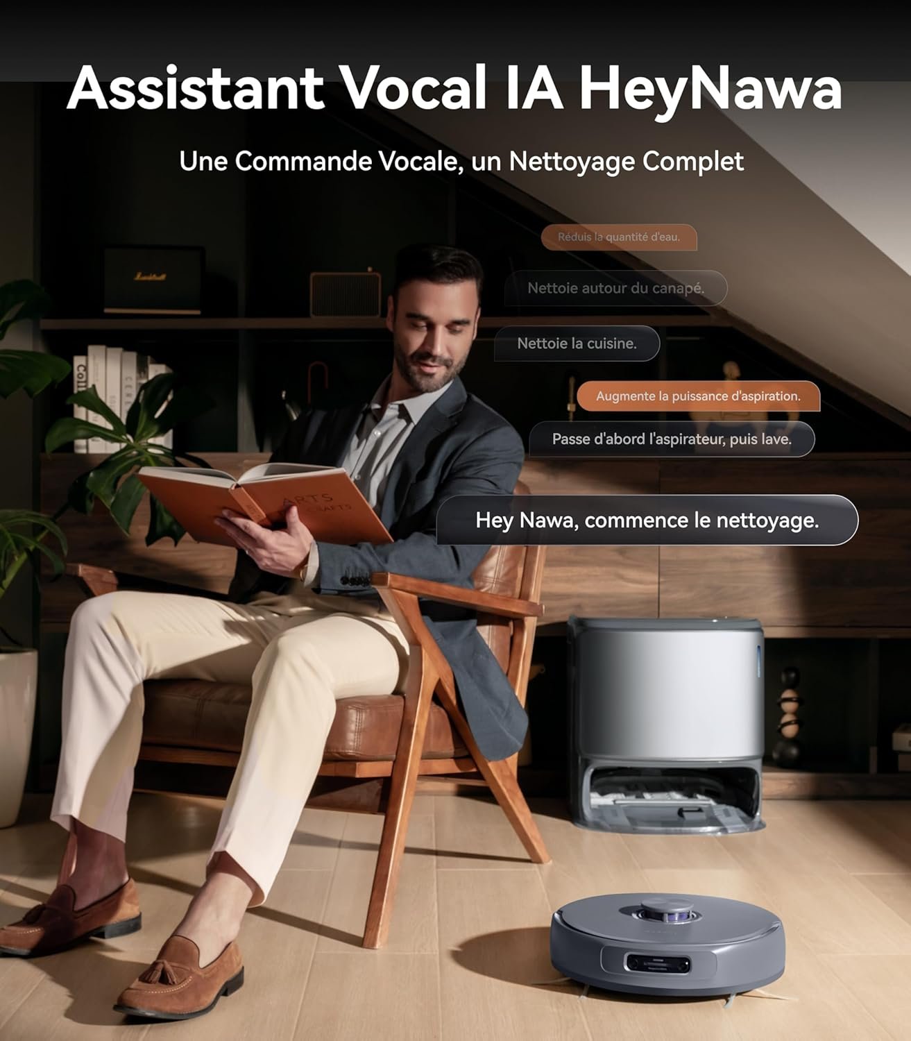 Un homme est assis sur une chaise en utilisant sa tablette tandis que l'aspirateur robot NARWAL FREO Z10 ULTRA GRIS nettoie silencieusement le sol à proximité dans un salon moderne.