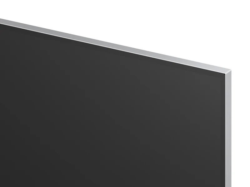 Gros plan d'un coin LG OLED65G5 2025 Gallery Design, mettant en valeur son design élégant avec un cadre argenté fin.