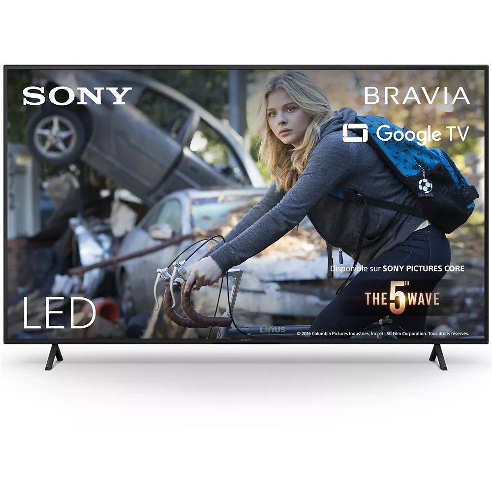 Un téléviseur intelligent SONY KD65W75WL affiche une scène de « La 5e Vague », montrant une fille avec des voitures accidentées en arrière-plan.