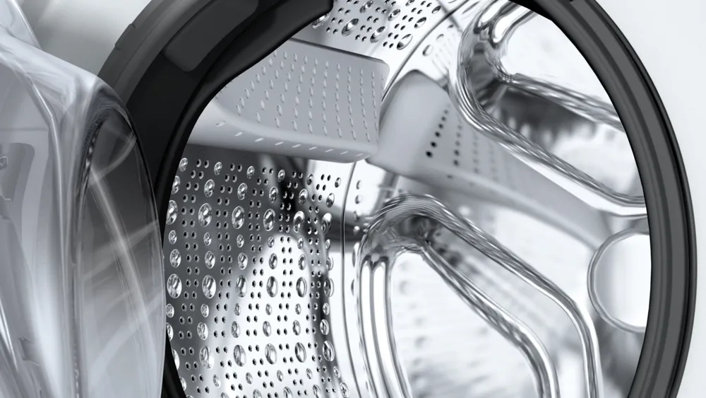 Gros plan sur le tambour du lave-linge BOSCH WGG254FAFR, qui présente un intérieur métallique élégant et un design moderne à chargement frontal.