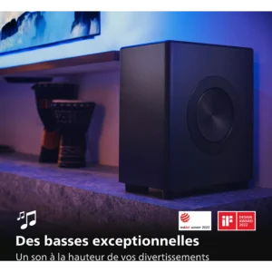 Un caisson de basse PHILIPS TAFW1/10 noir repose sur une étagère, mis en valeur par des critiques françaises élogieuses et des prix célébrant ses impressionnantes performances en matière de basses.