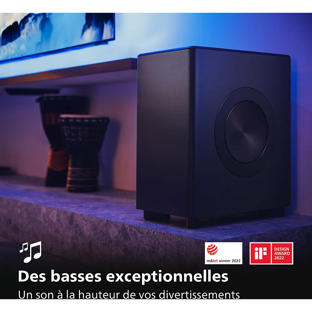 Un caisson de basse PHILIPS TAFW1/10 noir repose sur une étagère, mis en valeur par des critiques françaises élogieuses et des prix célébrant ses impressionnantes performances en matière de basses.