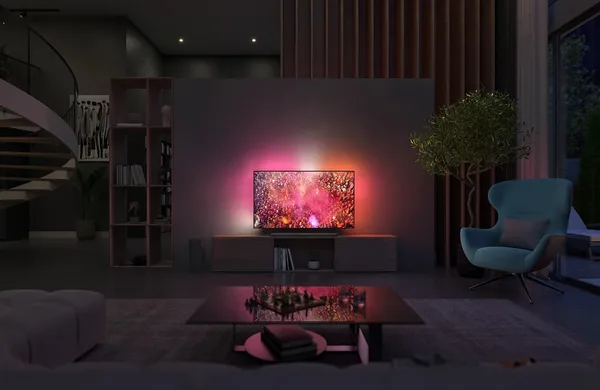 Un salon moderne présente le PHILIPS 65OLED850/12, un téléviseur OLED aux couleurs vives et à l'éclairage ambiant, fixé au mur.