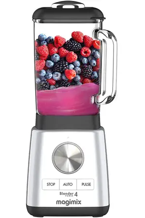Un mixeur MAGIMIX 11630 argenté rempli d'un smoothie rose, garni de baies assorties telles que des fraises et des mûres.