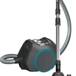 Le Miele BOOST CX1 POWERLINE est un aspirateur-traîneau de couleur grise et noire, doté d'un tuyau flexible et d'un tube d'aspiration en métal.