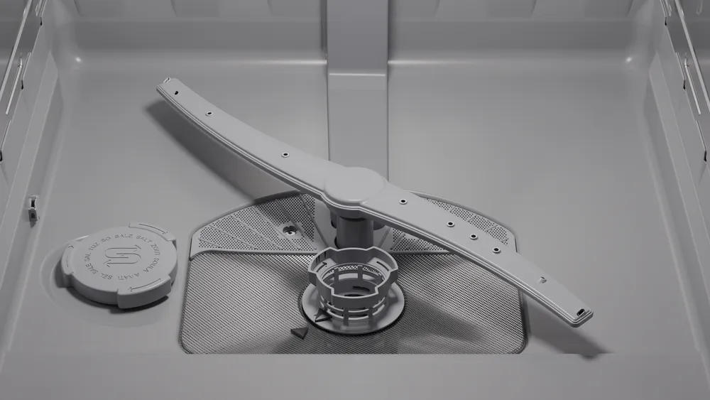 Vue rapprochée de l'intérieur inférieur du lave-vaisselle BOSCH SMS25AW10F, mettant en évidence le bras d'aspersion et les composants du filtre.