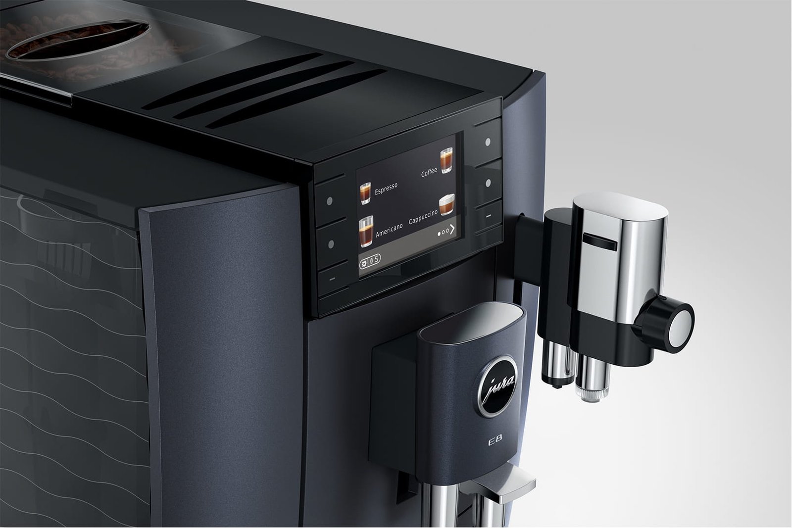 Gros plan sur la machine à café JURA E8 COSMIC BLACK (ED), avec son écran digital et ses élégantes touches de chrome.