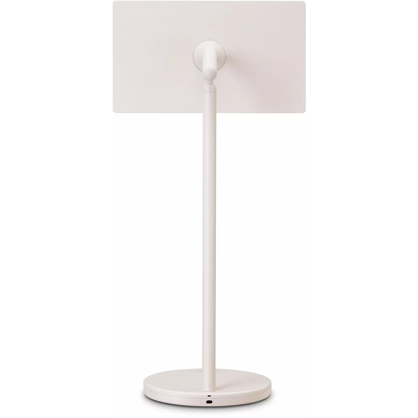 Le LG 27LX6 STANDBYME, un appareil électronique rectangulaire blanc, est présenté de dos sur un support rond sur fond blanc.