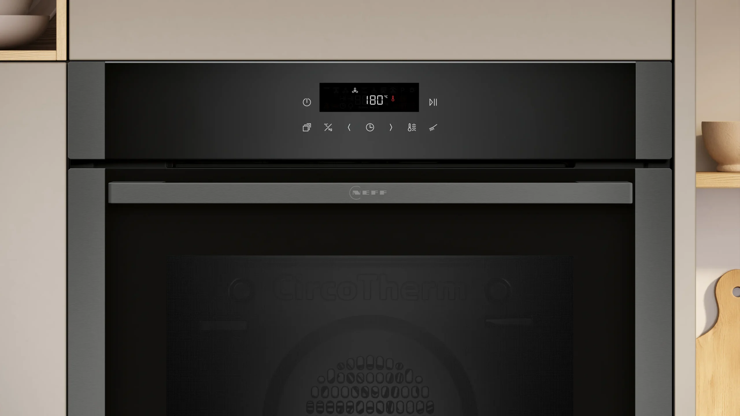 Gros plan du panneau de commande d'un four NEFF B2ACJ7AG0 réglé sur 180°C, avec des boutons et une porte de four sombre en dessous.