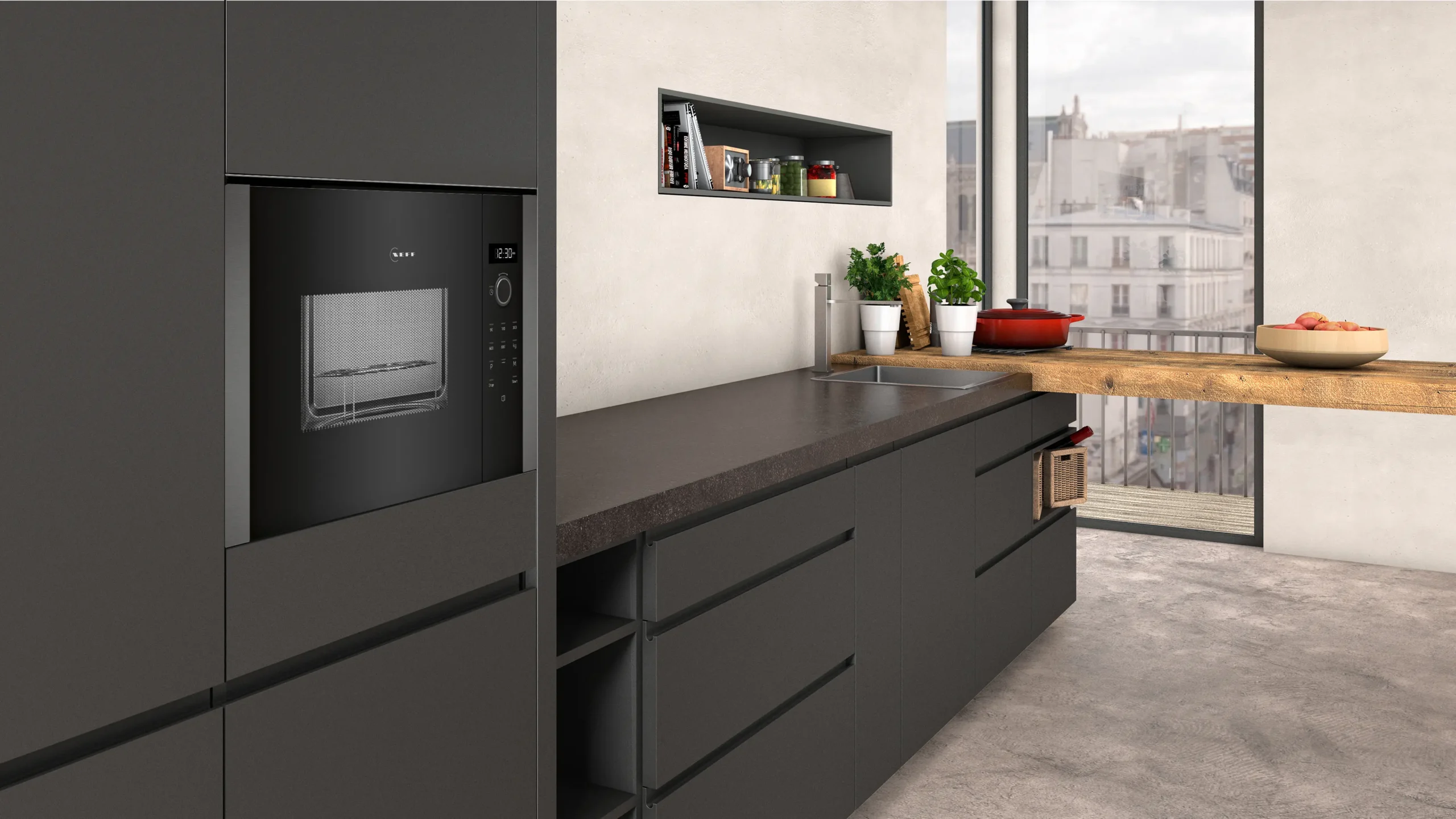 Cuisine moderne avec armoires foncées, four encastré NEFF HLAGD53G0, plantes de comptoir et vue imprenable sur la ville grâce à de grandes fenêtres.