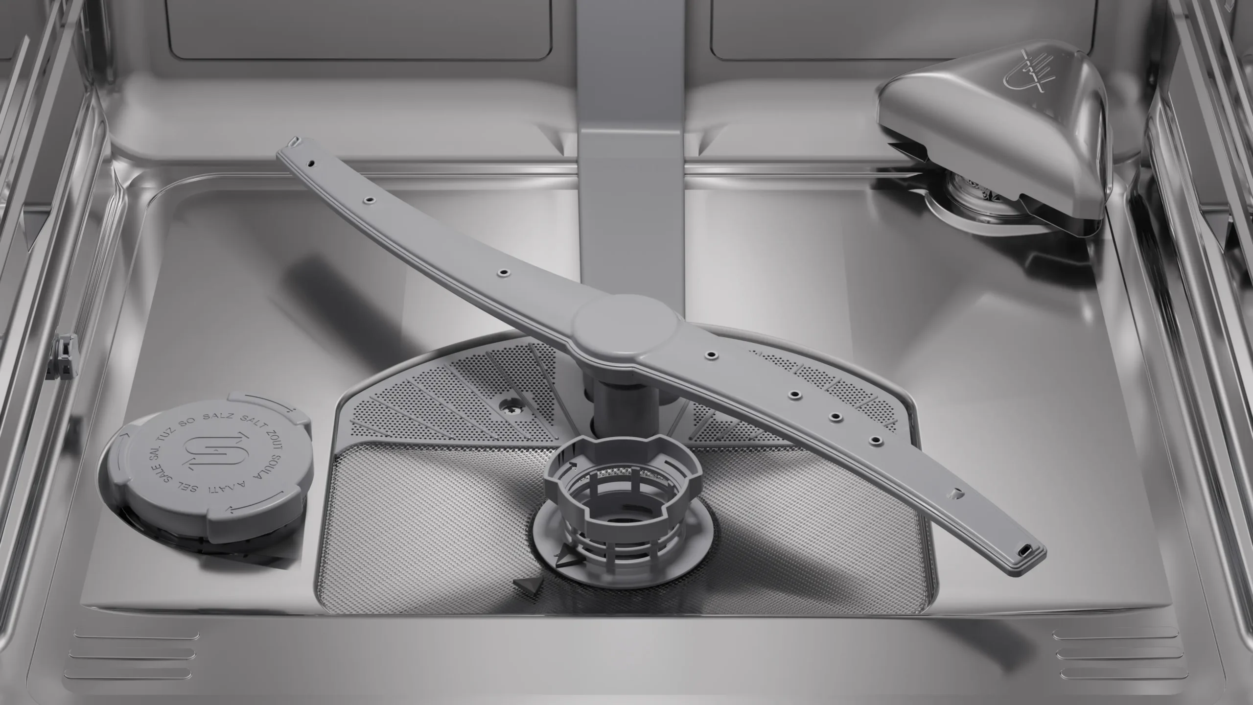 Gros plan sur l'intérieur propre et vide du lave-vaisselle SIEMENS SN65Z804CE, mettant en valeur sa finition en acier inoxydable, son bras gicleur et son filtre.