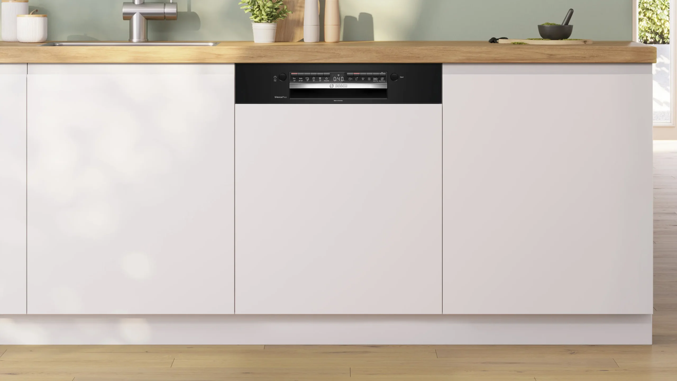 Le lave-vaisselle encastrable BOSCH SMI4HCB07E est doté d'un panneau de commande noir élégant et s'intègre dans un meuble de cuisine blanc sous un comptoir en bois.