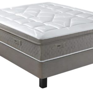 Le matelas EPEDA GALACTIQUE 2 160x200 présente un design moderne et épais avec un dessus matelassé blanc et est placé sur un sommier tapissier avec des pieds noirs.