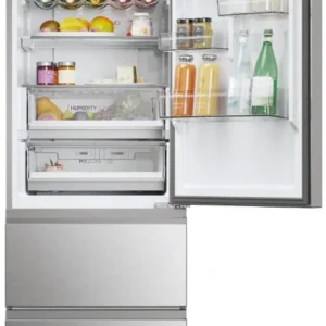 Le réfrigérateur HAIER HTW5618ENMG présente des boissons, des desserts, des fruits et des condiments bien organisés sur ses étagères et à l'intérieur de ses tiroirs.