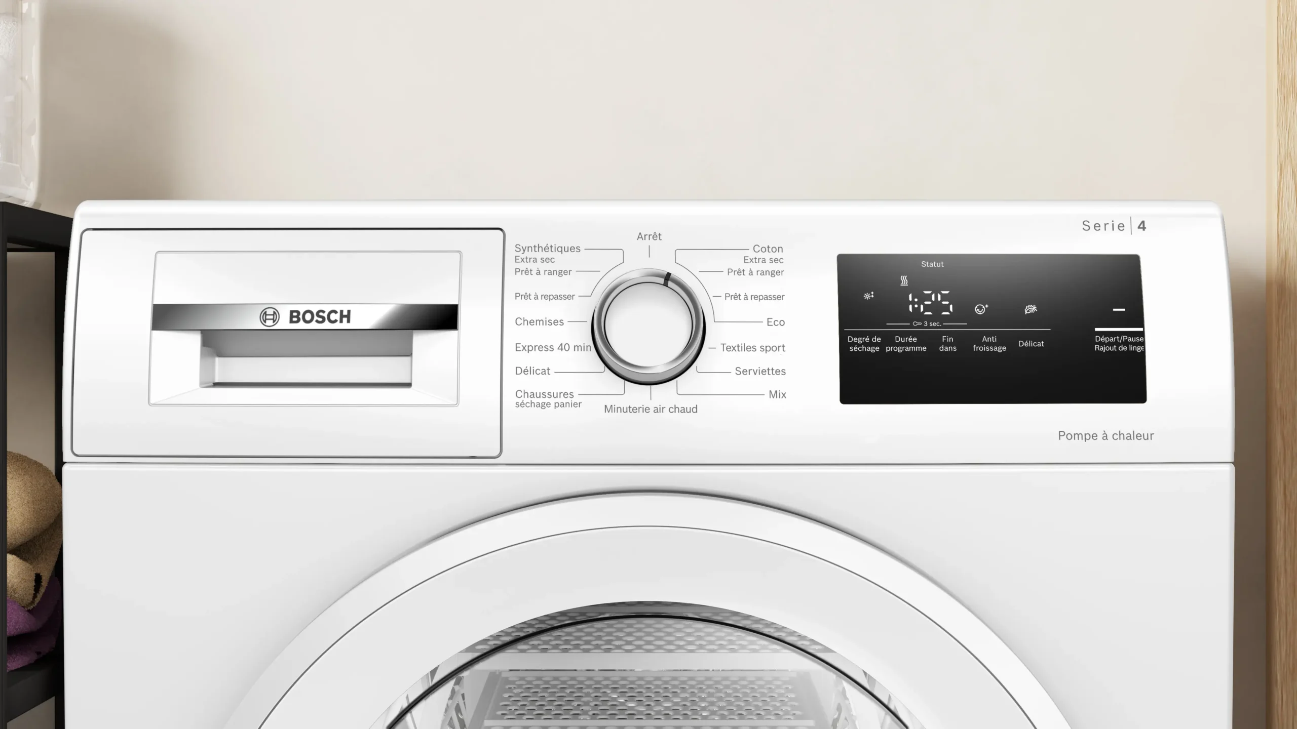 Gros plan du panneau de commande d'un lave-linge BOSCH Serie 4 avec boutons et affichage numérique, présenté à côté du sèche-linge BOSCH WTH8520MFR.