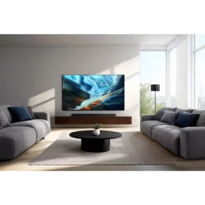 Salon moderne comprenant deux canapés gris, une table basse ronde et un téléviseur mural SAMSUNG TQ65S92H affichant un écran lumineux.