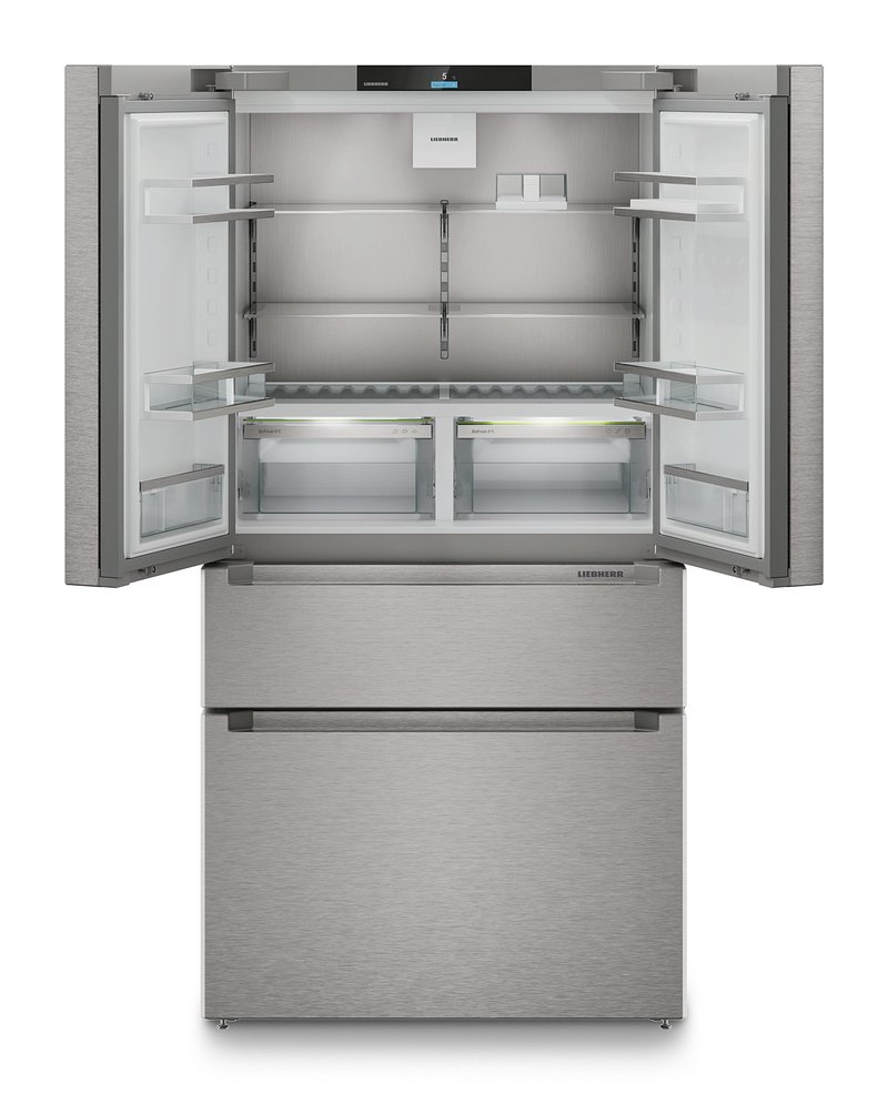 Ouvrez le réfrigérateur LIEBHERR MBSDDI9524-20 à portes françaises en acier inoxydable, dont on aperçoit les étagères vides et les deux tiroirs du congélateur situés en bas.