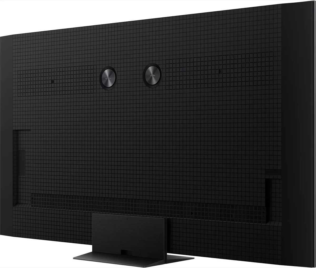 Vue arrière du TCL 65C8L, un téléviseur à écran plat noir présentant un motif en grille et deux points de fixation ronds.
