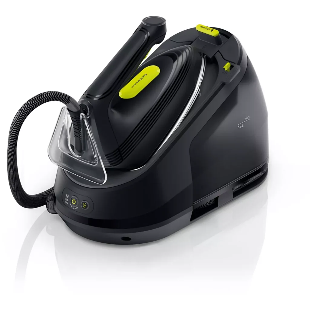 Un fer à vapeur BRAUN IS3257BK, de couleur noire et verte, dont le cordon est enroulé autour de la base, repose sur une surface blanche.
