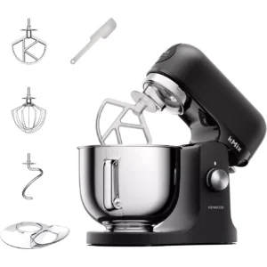 Le robot pâtissier KENWOOD KMX751ABK, au design épuré et à la finition noire, est livré avec un bol en acier inoxydable et de nombreux accessoires, le tout magnifiquement mis en valeur sur un fond blanc.