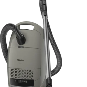 Le Miele GUARD M1 SILENCE est un aspirateur-traîneau gris équipé d'un tuyau flexible et d'une brosse pour sols, conçu pour un nettoyage à la fois puissant et silencieux.