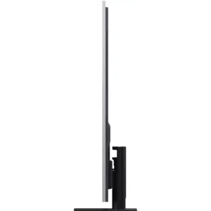 Une vue de profil du LG OLED65G66 2026, un écran d'ordinateur fin et plat posé sur un socle rectangulaire devant un fond blanc, met en valeur son design épuré et sa technologie d'affichage de nouvelle génération.